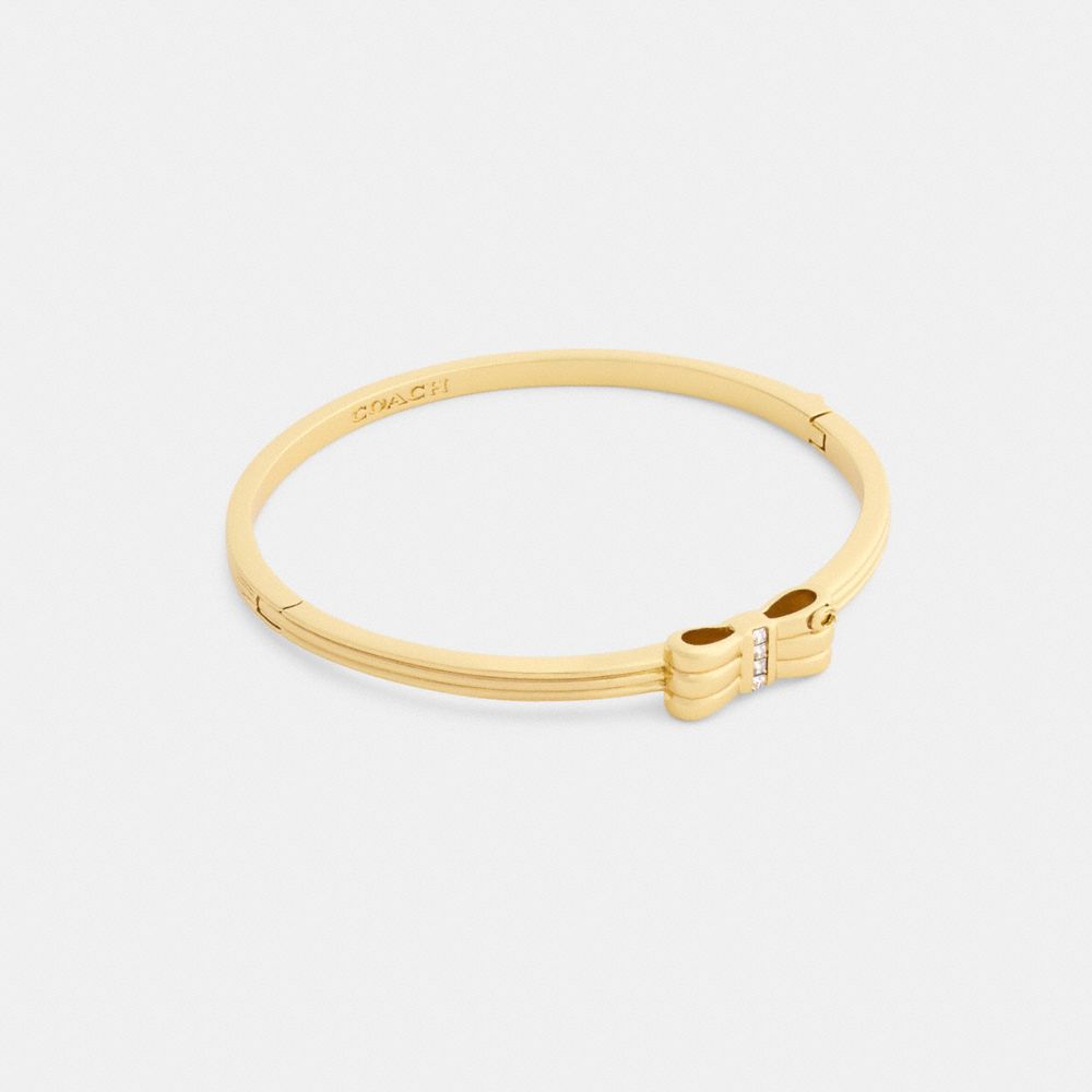 COACH®,Bow Hinged Bangle,Clear,Front View