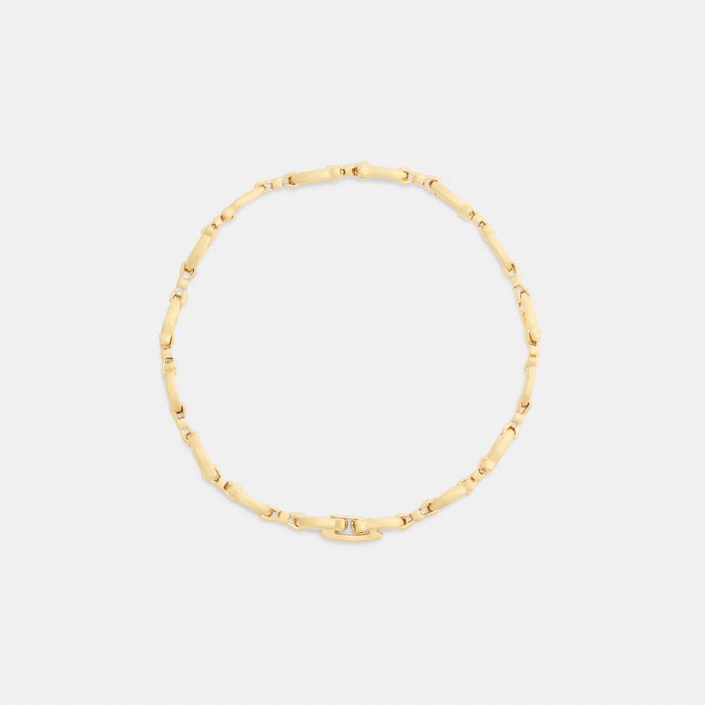 COACH®,Bow Chain Linear Bracelet,Cubic Zirconia,Bow,Lettering Word,Logo,Chain Link,Gold Metal,Casual,Clear,Inside View,Top View