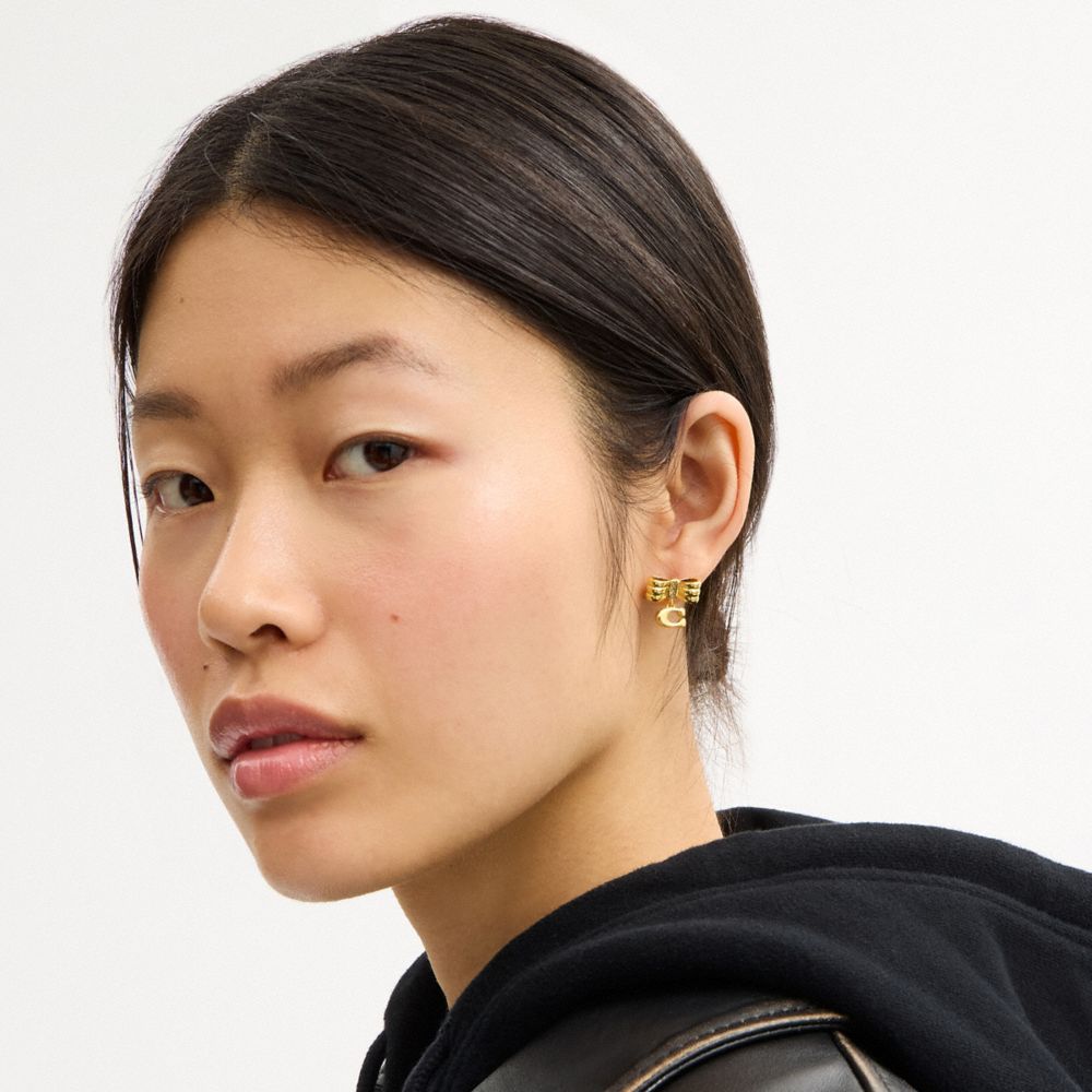 COACH®,Signature Bow Stud Earrings,Studs,Cubic Zirconia,Glass,Initials Embellishment,Lettering Word,Logo,Gem Embellishment...,Yellow,Detail View