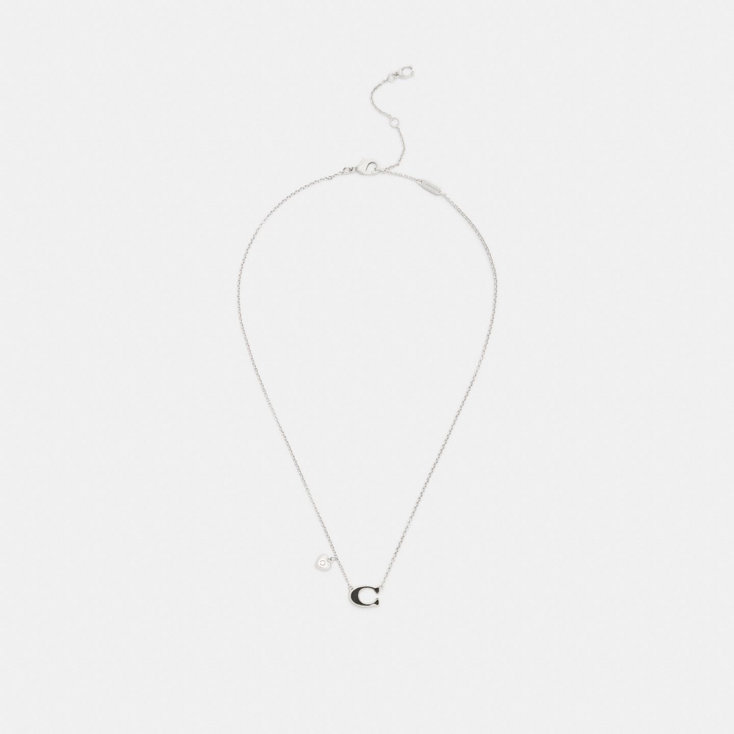 Женское колье Coach Enamel Signature Heart Charm Pendant, цвет: Серебряный / Чёрный — фото 2