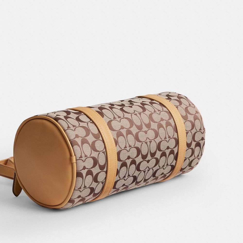 Женские сумки Coach Kisslock Barrel In Signature Jacquard — фото 5