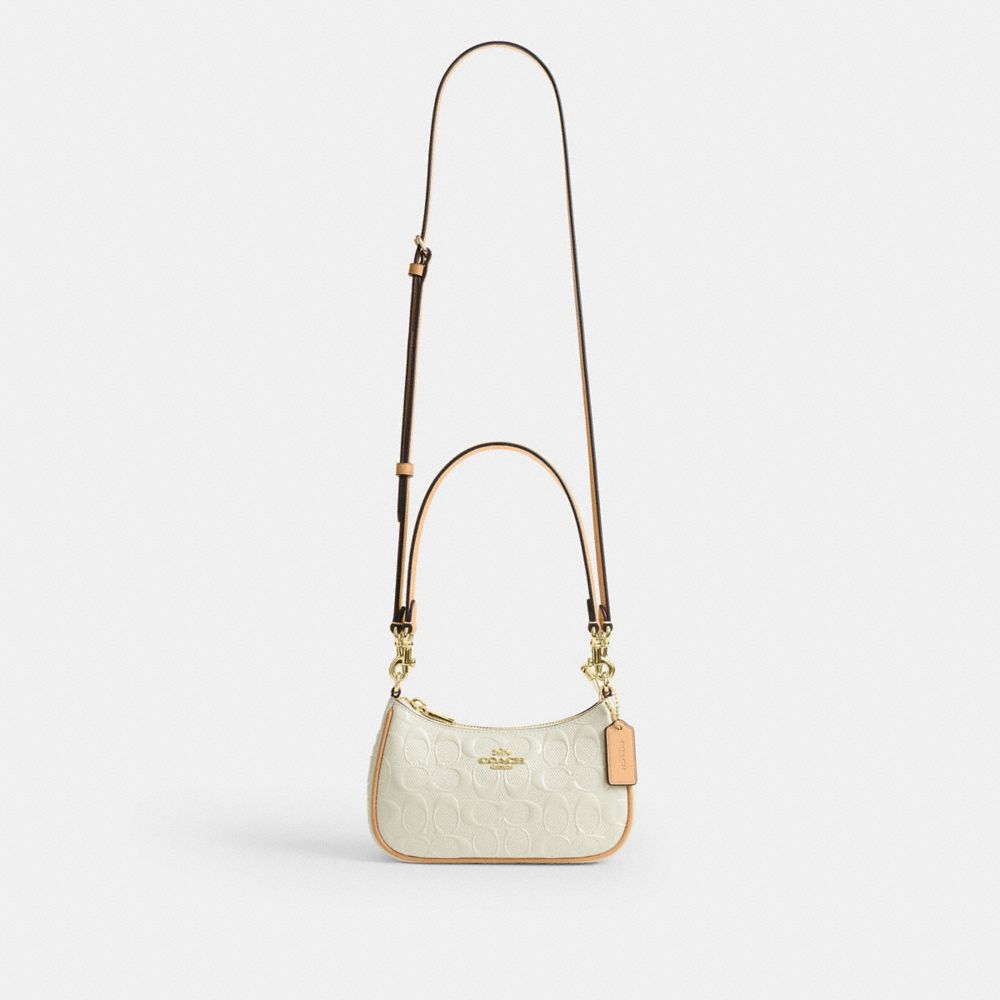 Teri Mini Crossbody Bag In Signature Leather
