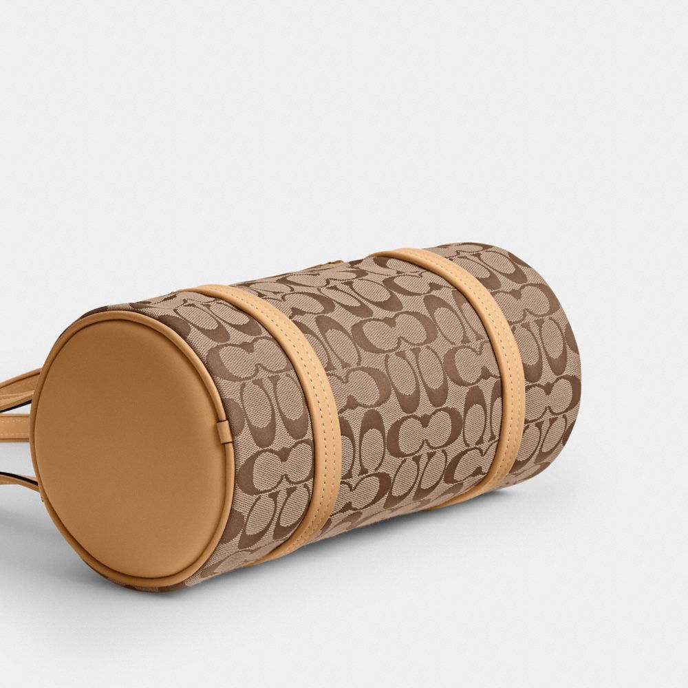 Женские сумки Coach Kisslock Barrel Bag 28 In Signature Jacquard — фото 5