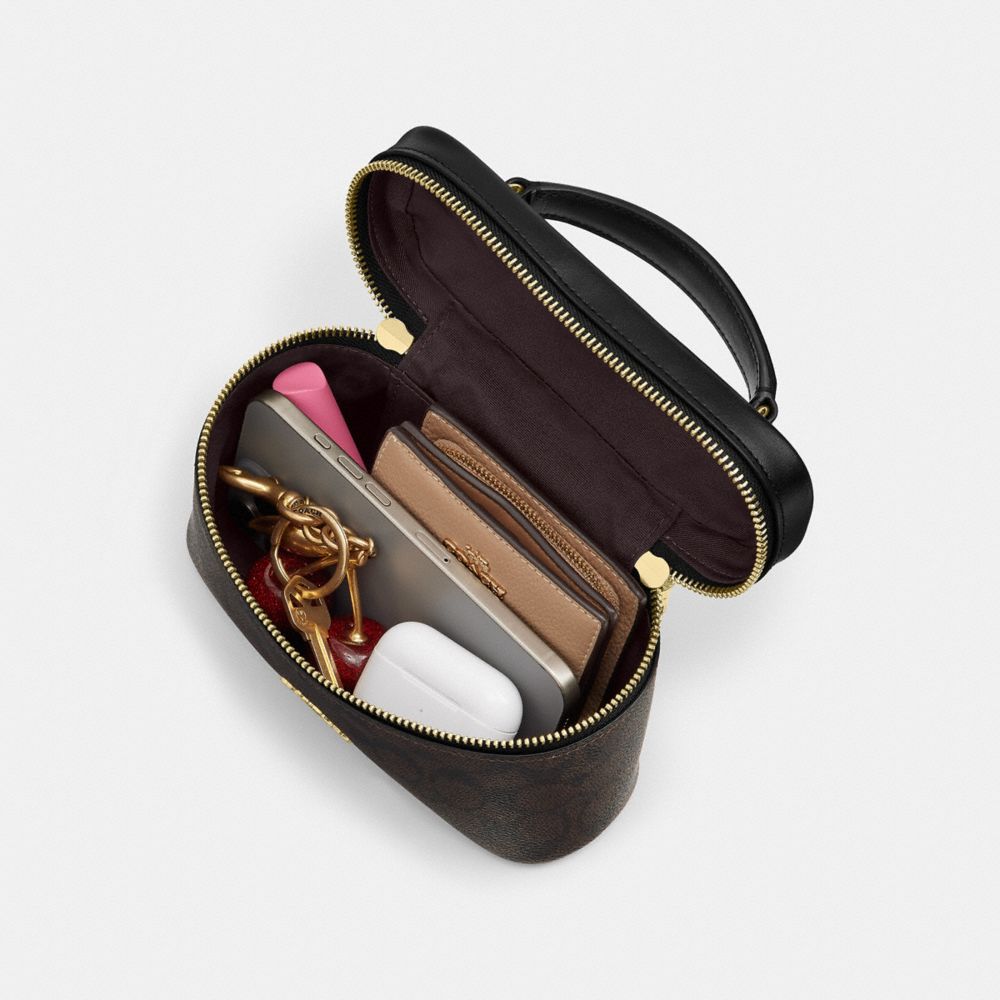Rainer Crossbody Bag 18 Signature Canvas