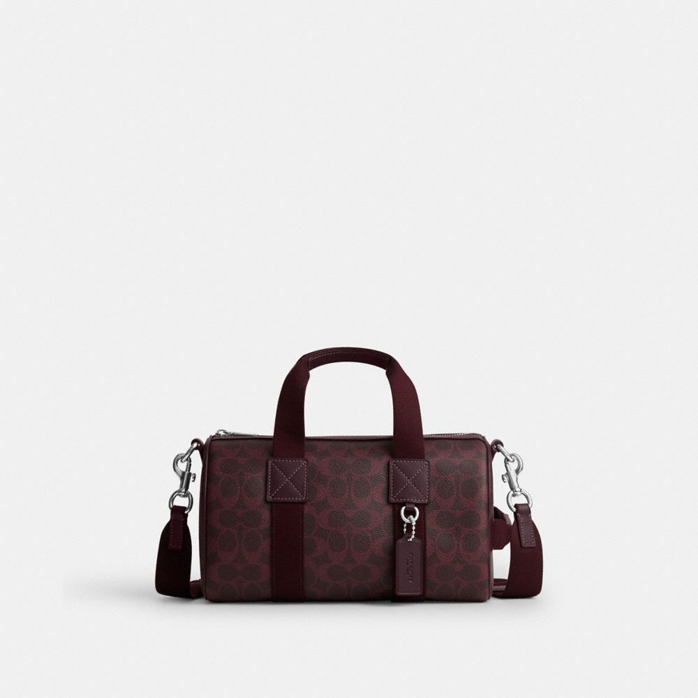COACH®,SAC POLOCHON EXPLORER 28 EN TOILE EXCLUSIVE,Tissu en toile exclusif,ARGENT/Cassis,Front View