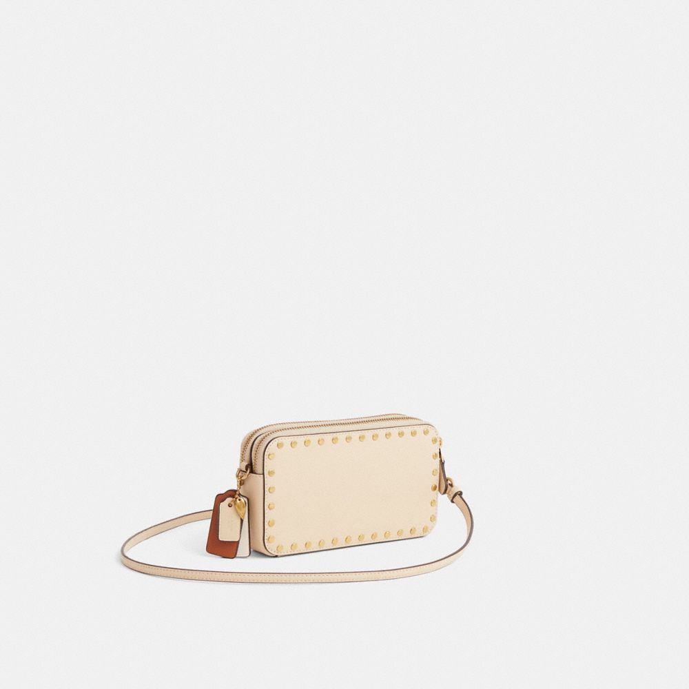 COACH®,Upcrafted Kira Crossbody Bag With Rivets,Cream,Angle View