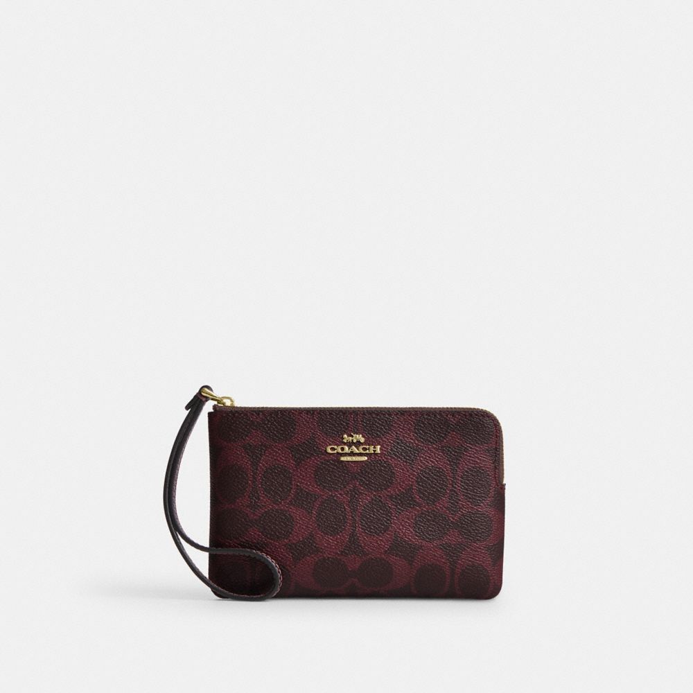 COACH®,WRISTLET À ZIP EN COIN EN TOILE SIGNATURE,Tissu en toile exclusif,Or/Cassis,Front View