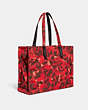 COACH®,100 PERCENT RECYCLED CANVAS TOTE 42 WITH CAMO PRINT AND REXY,Recycled Canvas,X-Large,Rexy,Red Camo,Angle View