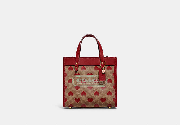COACH®,FIELD TOTE 22 IN SIGNATURE CANVAS WITH HEART PRINT,canvas,Medium,Brass/Tan Red Apple,Front View