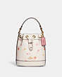 COACH®,DEMPSEY DRAWSTRING BUCKET BAG 15 WITH SHOOTING STAR PRINT,Refined Pebble Leather,Medium,Gold/Chalk Multi,Front View