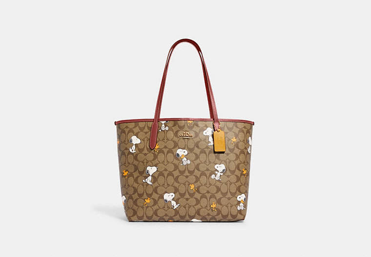COACH®,COACH X PEANUTS CITY TOTE BAG IN SIGNATURE CANVAS WITH SNOOPY WOODSTOCK PRINT,Signature Coated Canvas,X-L...,Gold/Khaki/Redwood Multi,Front View