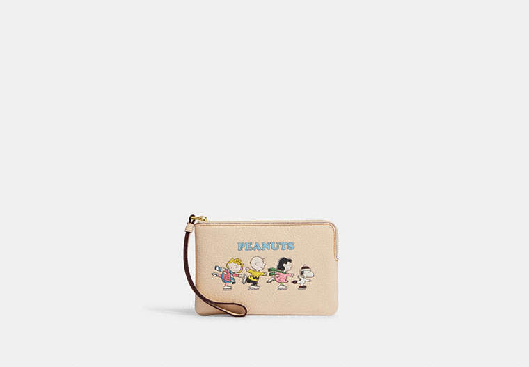 COACH®,COACH X PEANUTS CORNER ZIP WRISTLET WITH SNOOPY AND FRIENDS MOTIF,Refined Pebble Leather,Mini,Gold/Ivory Multi,Front View