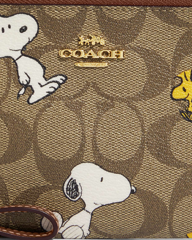 COACH® | Coach X Peanuts Corner Zip Wristlet In Signature Canvas