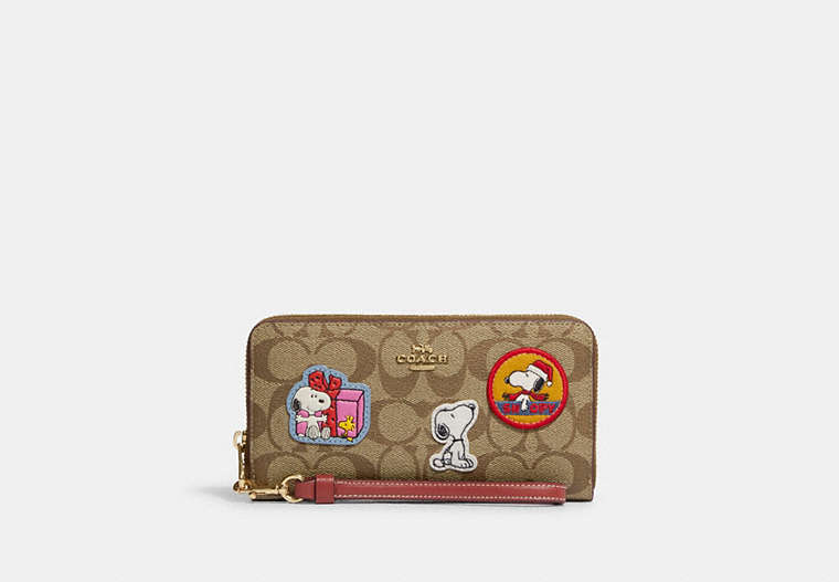 COACH®,COACH X PEANUTS LONG ZIP AROUND WALLET IN SIGNATURE CANVAS WITH PATCHES,Signature Coated Canvas,Mini,Gold/Khaki/Redwood Multi,Front View