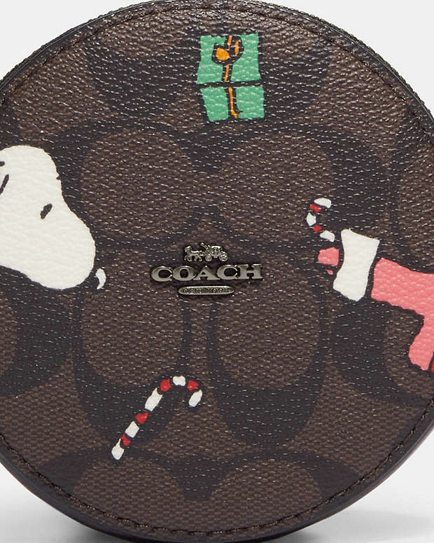 COACH® | Coach X Peanuts Round Coin Case In Signature Canvas With