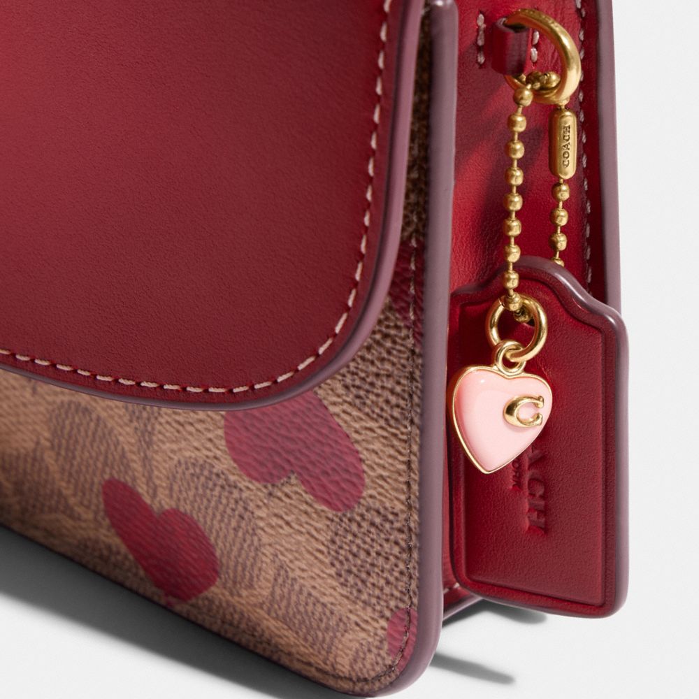 Heart Wristlet In Signature Canvas With Heart Print - Coach