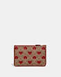 COACH®,SMALL WRISTLET IN SIGNATURE CANVAS WITH HEART PRINT,canvas,Brass/Tan Red Apple,Back View