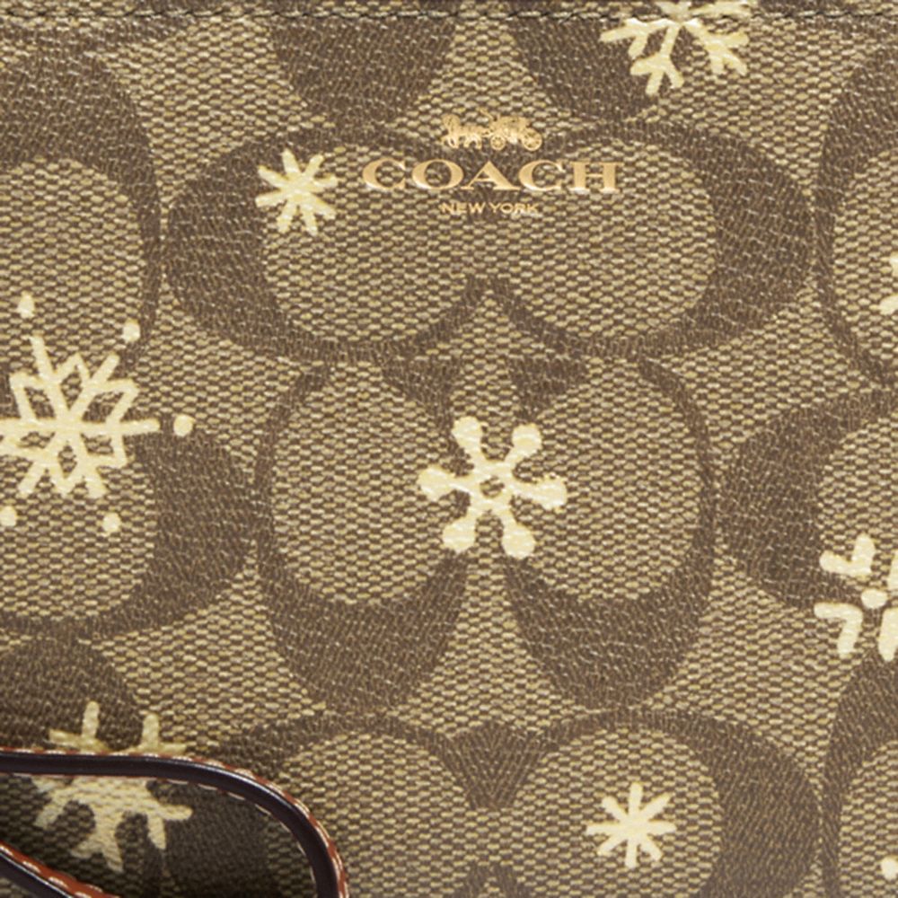 COACH®,Corner Zip Wristlet In Signature Canvas With Snowflake Print,,Detail View