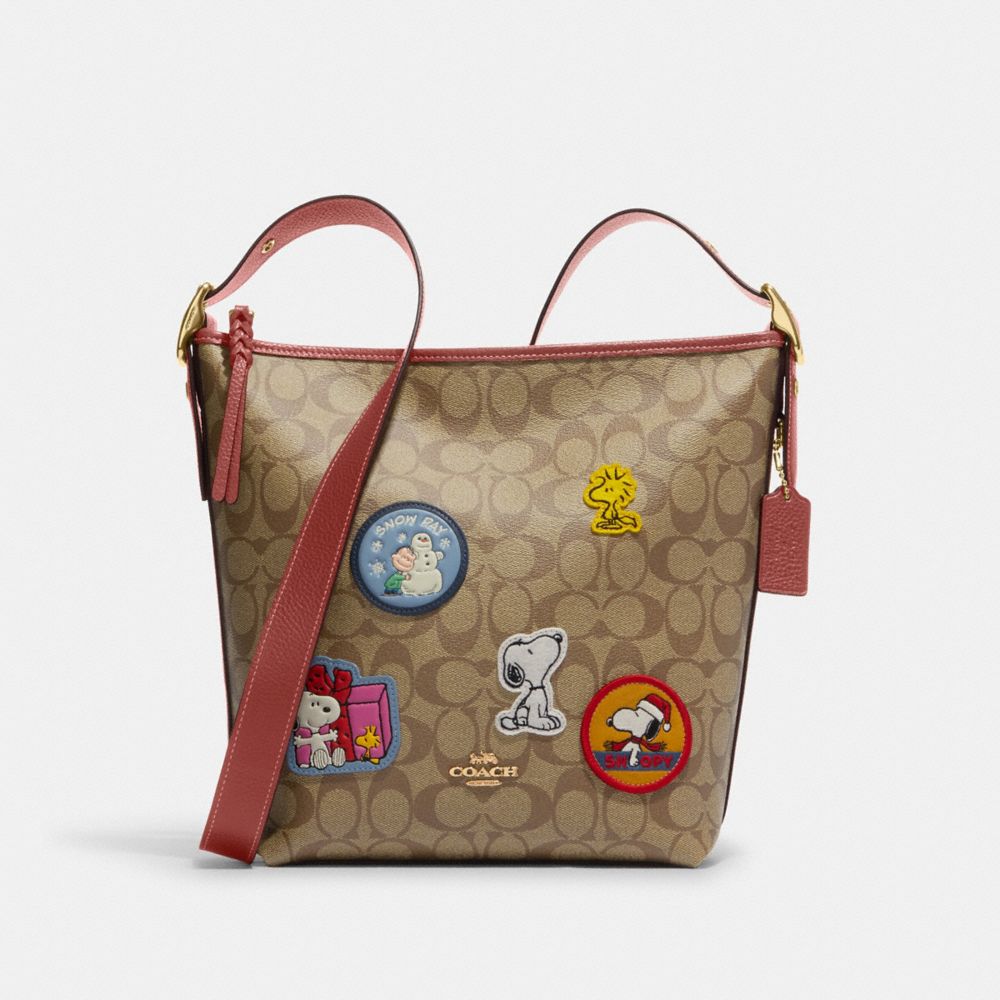 COACH®  Coach X Peanuts Round Coin Case In Signature Canvas With