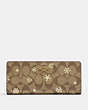 COACH®,SLIM WALLET IN SIGNATURE CANVAS WITH SNOWFLAKE PRINT,Signature Coated Canvas,Im/Khaki/Gold Multi,Front View