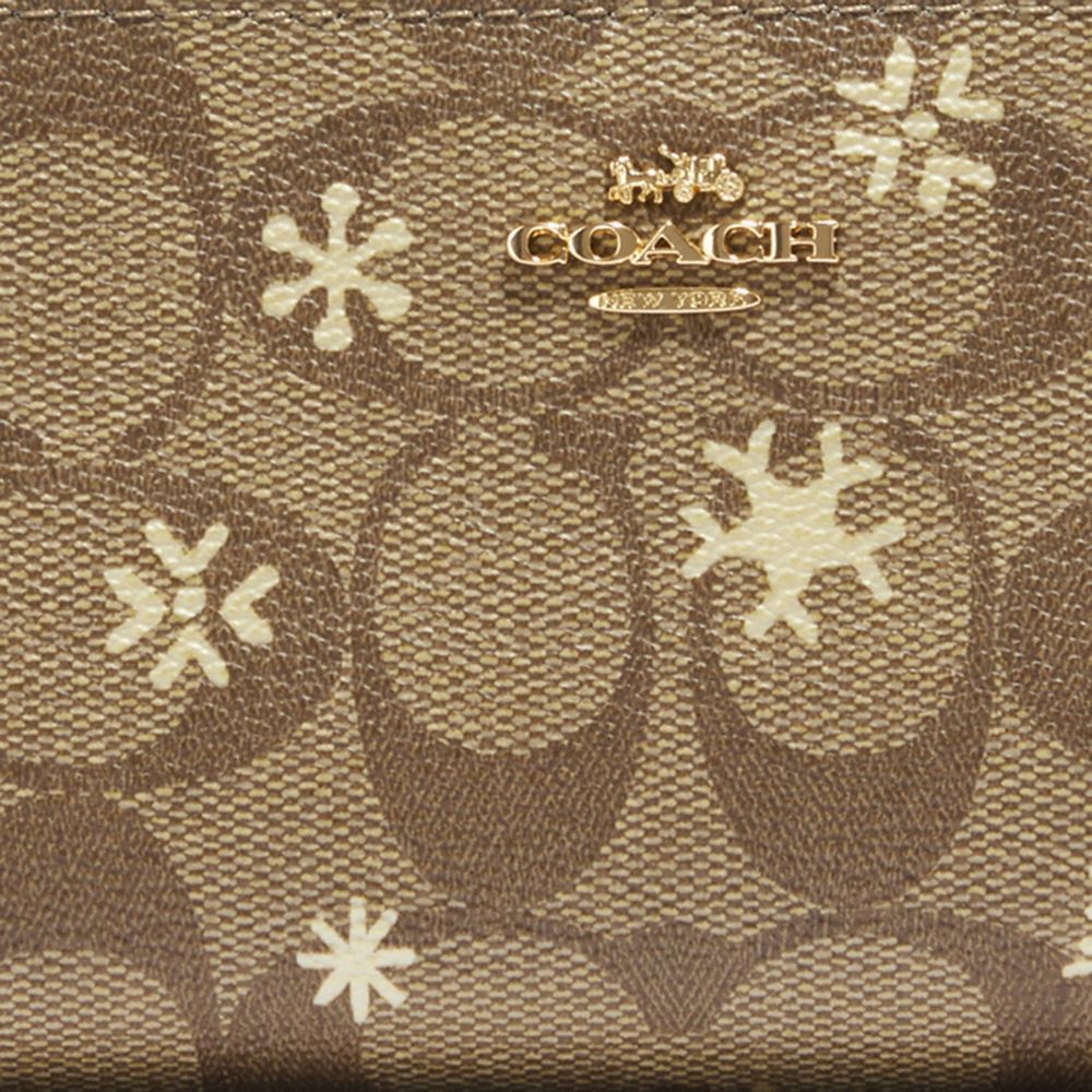 COACH®,Slim Wallet In Signature Canvas With Snowflake Print,,Detail View