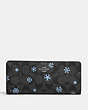 COACH®,SLIM WALLET IN SIGNATURE CANVAS WITH SNOWFLAKE PRINT,Signature Coated Canvas,Silver/Graphite/Cornflower Multi,Front View