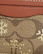 COACH®,CARD CASE IN SIGNATURE CANVAS WITH SNOWFLAKE PRINT,Signature Coated Canvas,Mini,Im/Khaki/Gold Multi,Detail View