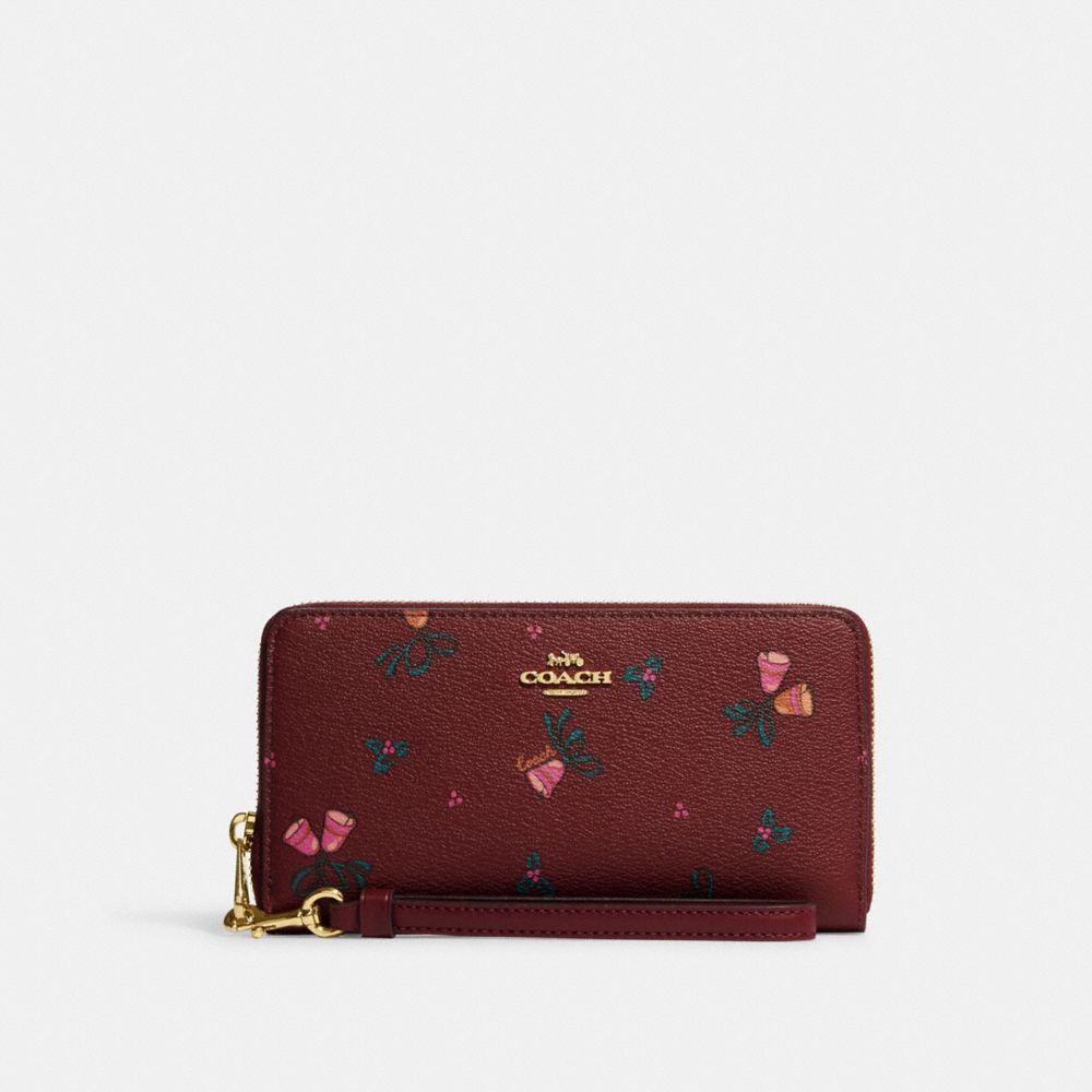 COACH®,PORTEFEUILLE LONG À ZIP-CONTOUR AVEC IMPRIMÉ DE CLOCHETTES DES FÊTES,Toile enduite imprimée,Or/Cerise noire multi,Front View