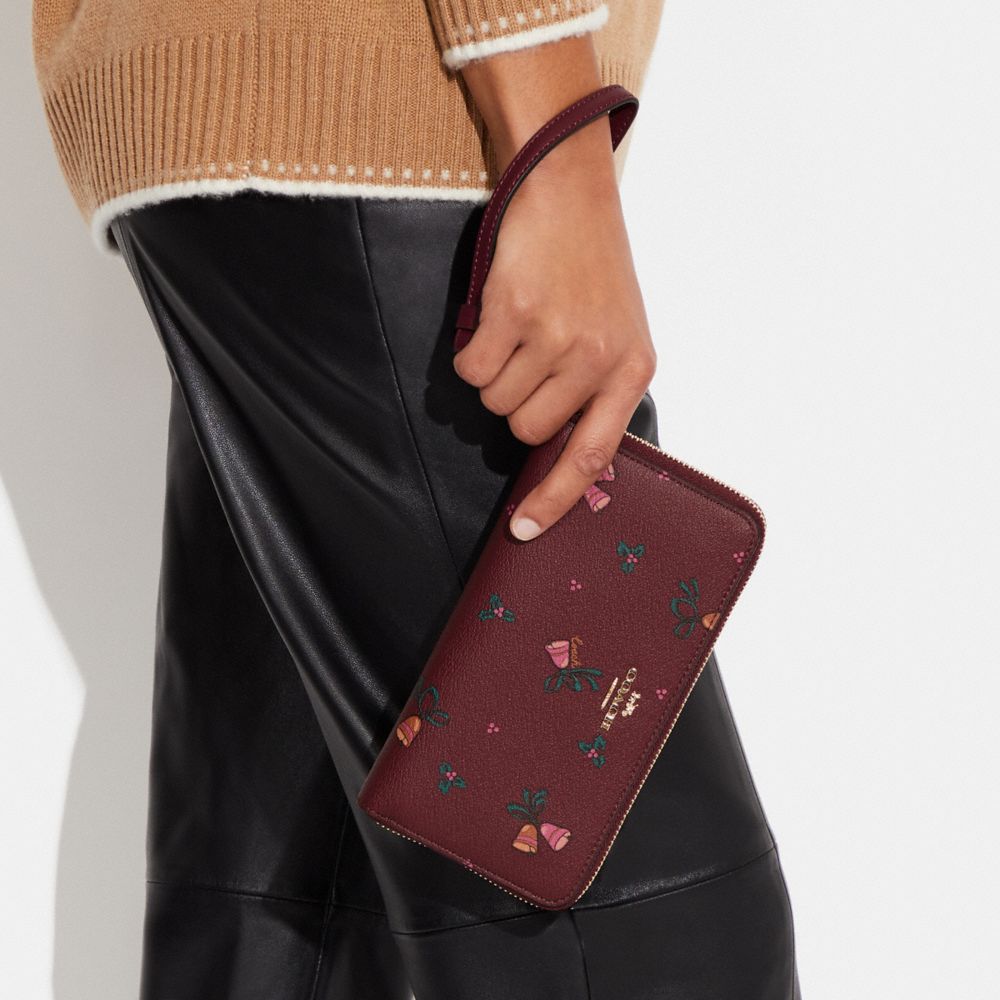 COACH®,LONG ZIP AROUND WALLET WITH HOLIDAY BELLS PRINT,Mini,Gold/Black Cherry Multi,Detail View
