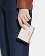 COACH®,SMALL TRIFOLD WALLET IN COLORBLOCK,Crossgrain Leather,Gold/Chalk Multi,Detail View