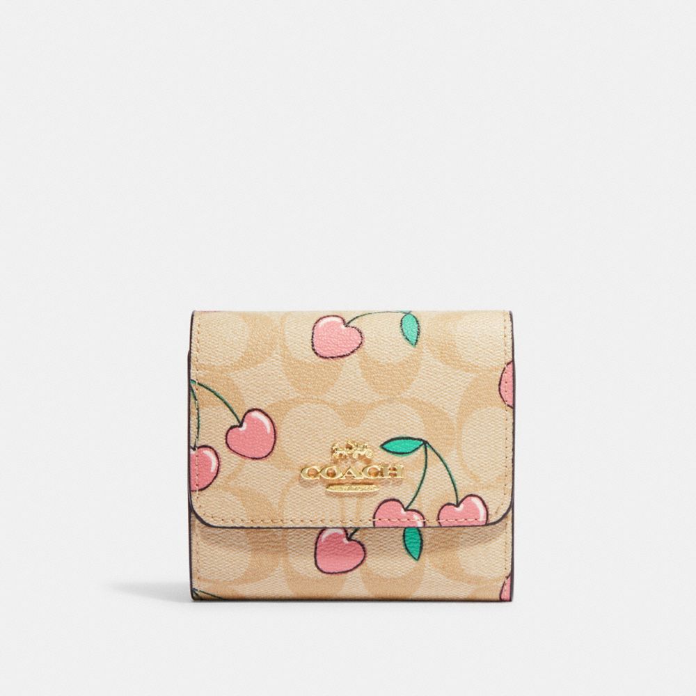 COACH® | Small Trifold Wallet In Signature Canvas With Heart