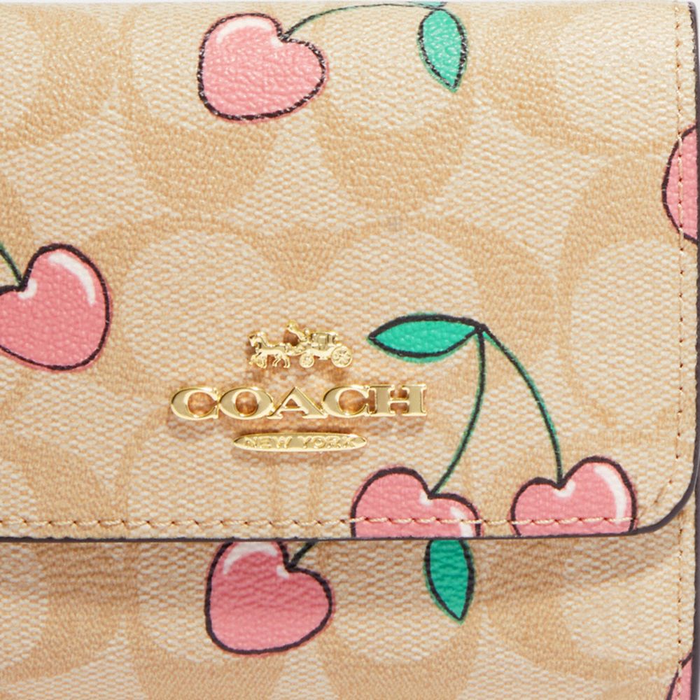 COACH® | Small Trifold Wallet In Signature Canvas With Heart