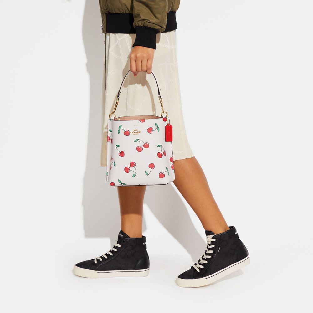 COACH®  Mollie Bucket Bag In Signature Canvas With Heart Cherry Print