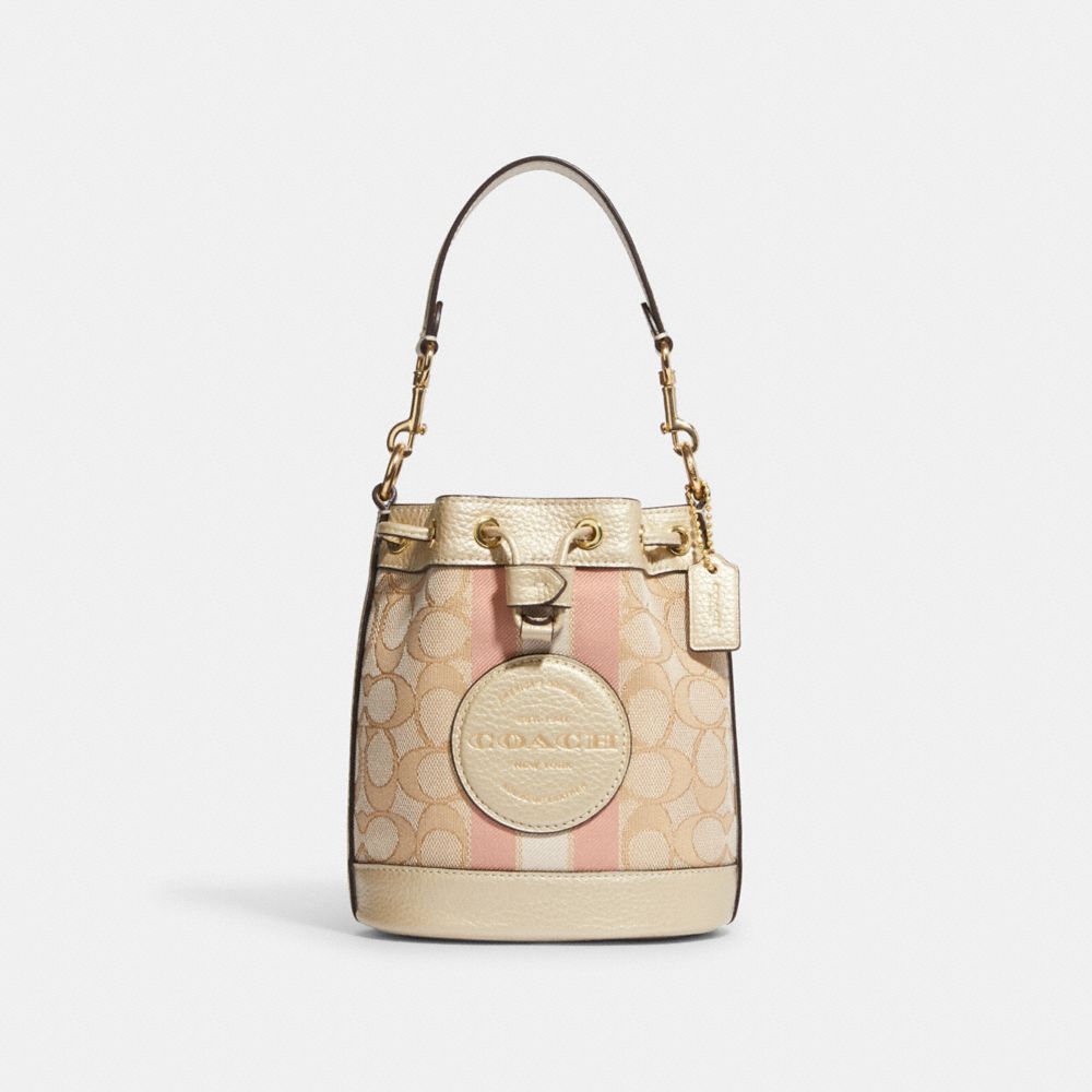 COACH OUTLET®  Mini Dempsey Bucket Bag In Signature Jacquard With Stripe  And Coach Patch