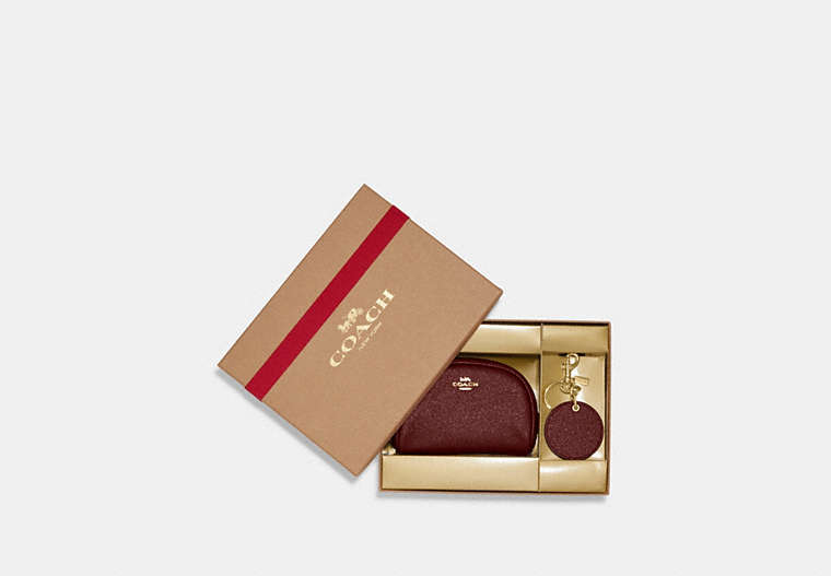 COACH®,BOXED DOME COSMETIC CASE AND MIRROR BAG CHARM SET,Crossgrain Leather,Mini,Gold/Black Cherry,Front View