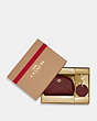 COACH®,BOXED DOME COSMETIC CASE AND MIRROR BAG CHARM SET,Crossgrain Leather,Mini,Gold/Black Cherry,Front View