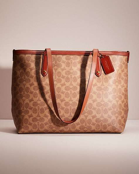 COACH®,RESTORED CENTRAL TOTE WITH ZIP IN SIGNATURE CANVAS,X-Large,Brass/Tan/Rust,Front View