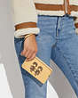 COACH®,CORNER ZIP WRISTLET WITH GEMINI,Refined Calf Leather,Mini,Silver/Vanilla Multi,Detail View