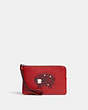 COACH®,CORNER ZIP WRISTLET WITH ARIES,Refined Pebble Leather,Mini,Silver/Bright Cardinal Multi,Front View