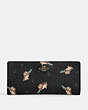 COACH®,SLIM ZIP WALLET WITH PENGUIN PRINT,Printed Coated Canvas,Gold/Black Multi,Front View