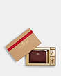 COACH®,BOXED CORNER ZIP WRISTLET,Crossgrain Leather,Mini,Gold/Black Cherry,Front View