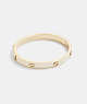 COACH®,PEGGED SIGNATURE HINGED BANGLE,enamel,Gold/Chalk,Front View