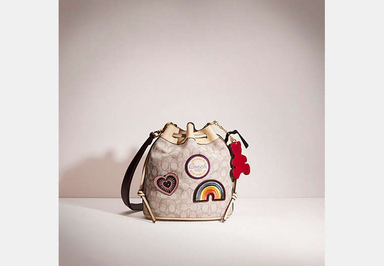 COACH®,UPCRAFTED FIELD BUCKET BAG IN SIGNATURE JACQUARD,Brass/Stone Ivory,Front View