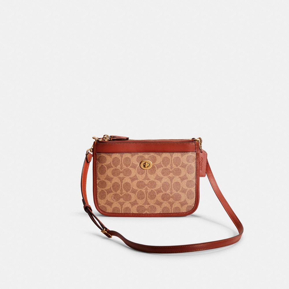 Coach signature east on sale west pop crossbody