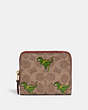 COACH®,BILLFOLD WALLET IN SIGNATURE CANVAS WITH REXY PRINT,Signature Coated Canvas,Mini,Brass/Khaki/Rust,Front View