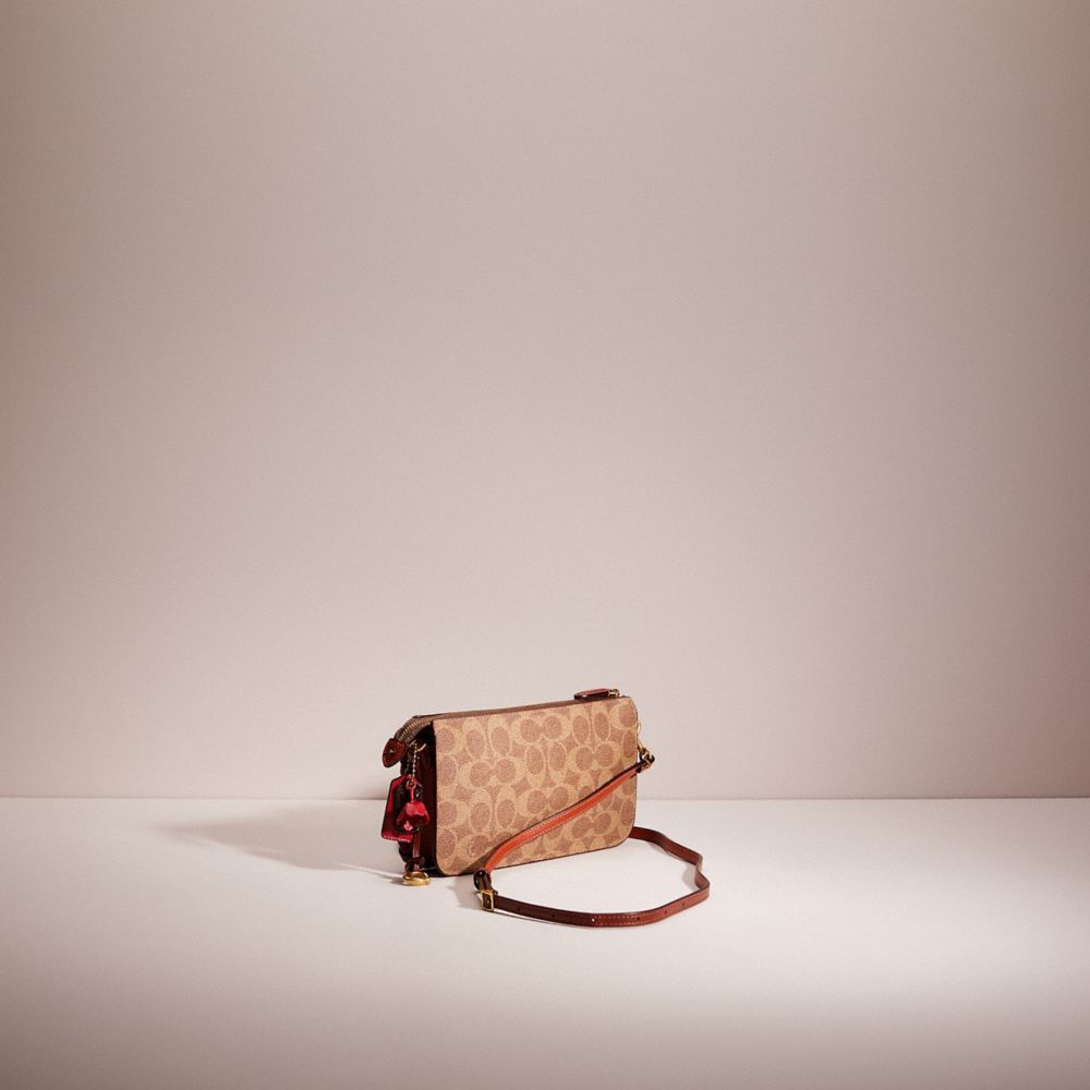 Hayden foldover crossbody clutch hot sale in colorblock signature canvas