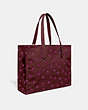 COACH®,LUNAR NEW YEAR TOTE 42 WITH RABBIT IN 100 PERCENT RECYCLED CANVAS,Recycled Canvas,X-Large,Brass/Wine Multi,Angle View