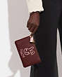COACH®,LUNAR NEW YEAR SMALL WRISTLET WITH RABBIT,Pebble Leather,Brass/Wine Multi,Detail View