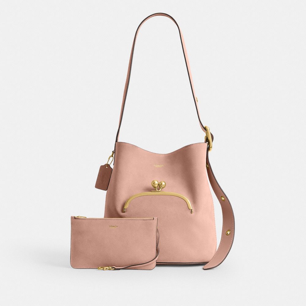 COACH®,Bleecker Bucket Bag With Kisslock,Suede,Leather,Bucket,Pendant,Adjustable,Brass,Day Party,Pink,Angle View