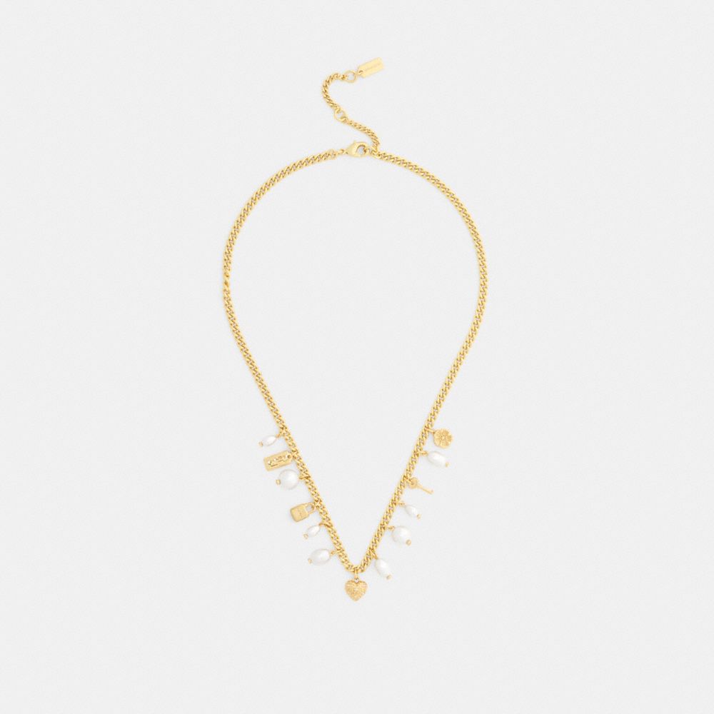 Женские брелоки Coach Pearl And Heart Charm Necklace — фото 2